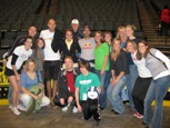 Todd Rogers and Phil Dalhausser pose with the DU Volleyball Team